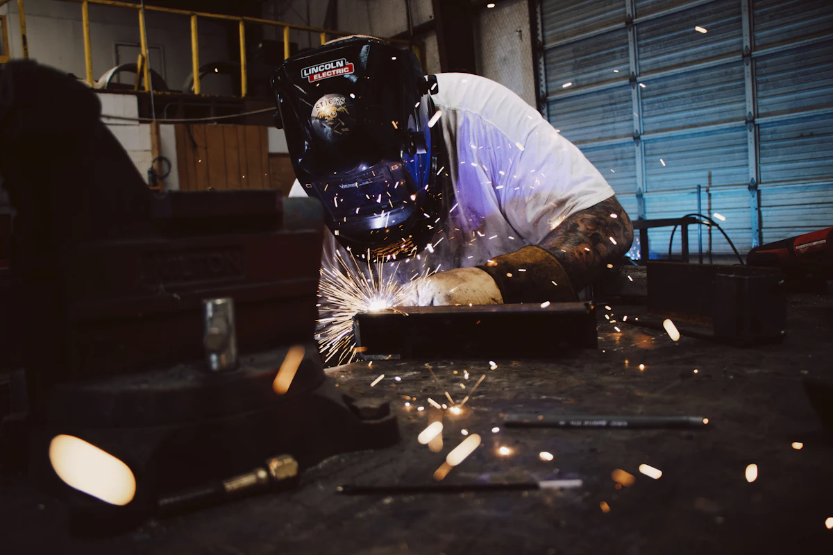 Mechanic welding in a workshop